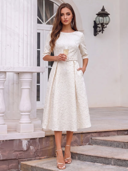 Robe de cocktail midi trapèze, col rond, demi-manches avec poches et ceinture