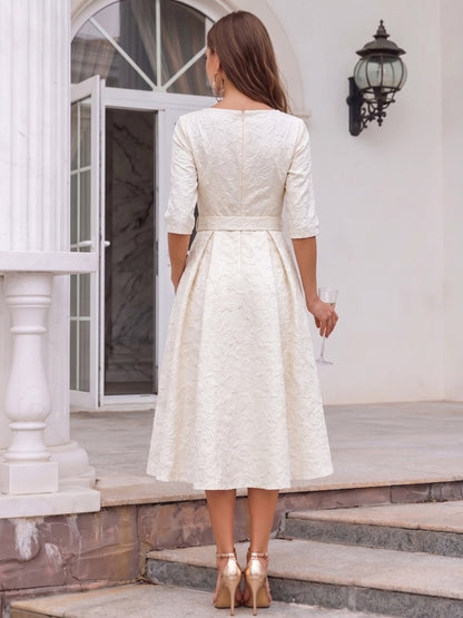 Robe de cocktail midi trapèze, col rond, demi-manches avec poches et ceinture