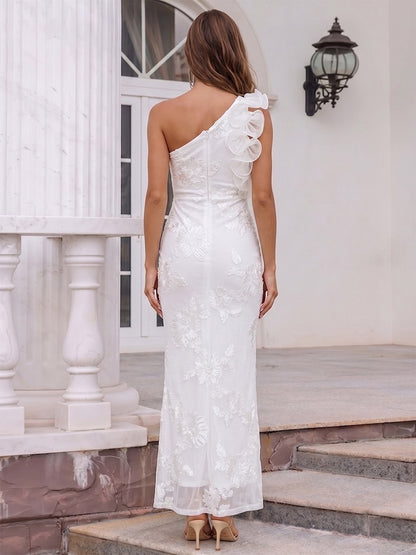 Robe de cocktail fourreau asymétrique longue cheville, avec volants et appliqués