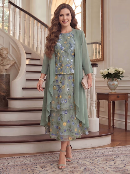 Robe trapèze/princesse en mousseline grande taille pour mère de la mariée : encolure ronde, manches 3/4, longueur mi-mollet, avec volants et broderies