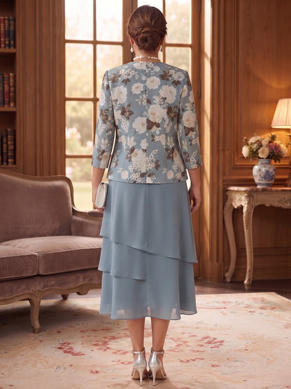 Robe trapèze/princesse en mousseline grande taille pour mère de la mariée : encolure ronde, manches 3/4, longueur mi-mollet, avec veste et volants