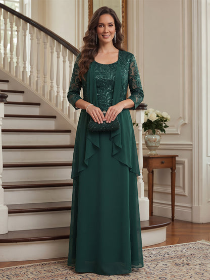 Robe de mère de la mariée longue en mousseline, coupe trapèze/princesse, encolure arrondie, manches 3/4, avec motifs appliqués et veste