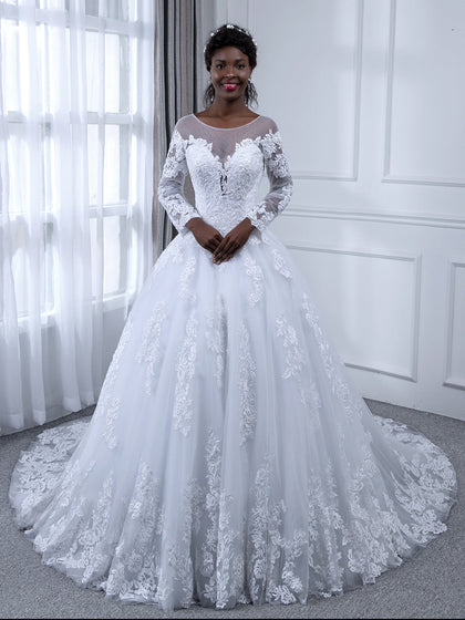 Robe de mariée en tulle à manches longues et col transparent avec appliques de perles