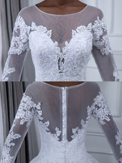 Robe de mariée en tulle à manches longues et col transparent avec appliques de perles