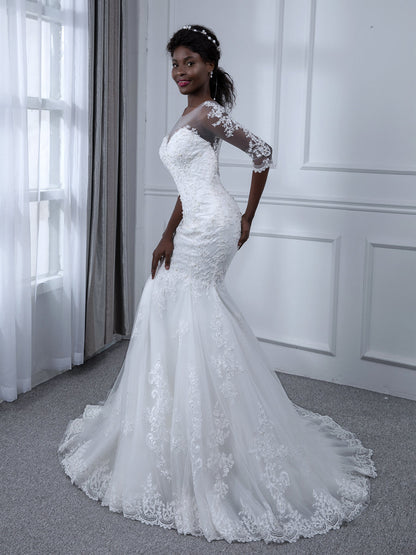 Robes de mariée sirène en tulle à manches 3/4 et col transparent avec appliques de perles