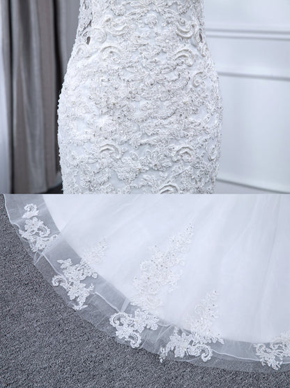 Robes de mariée sirène en tulle sans manches à col en V avec appliques de perles et paillettes